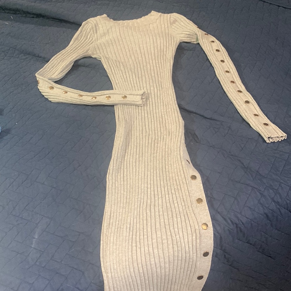 Hera Collection sweater midi dress with function gold snaps down the legs.